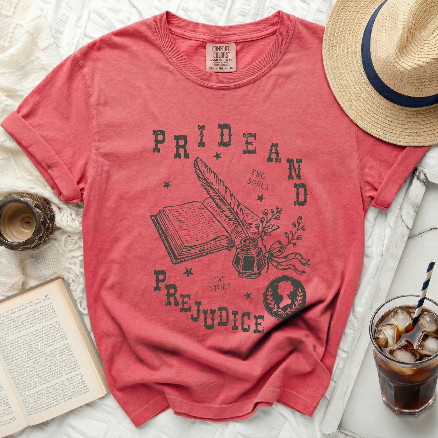 Salmon pink t-shirt with "Pride and Prejudice" graphic art.