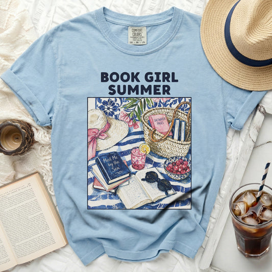 Light blue t-shirt with "Book Girl Summer" graphic, straw hat, books, and lemonade.