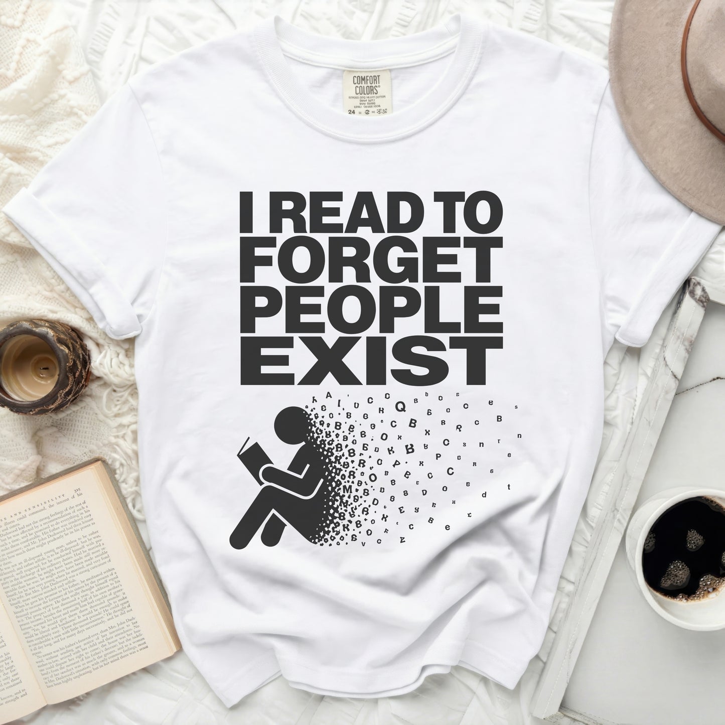 White t-shirt with "I READ TO FORGET PEOPLE EXIST" text and person reading.
