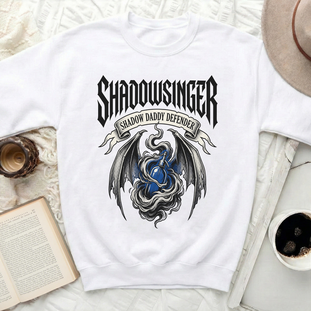 White sweatshirt with "Shadowsinger Shadow Daddy Defender" text and dragon wings.