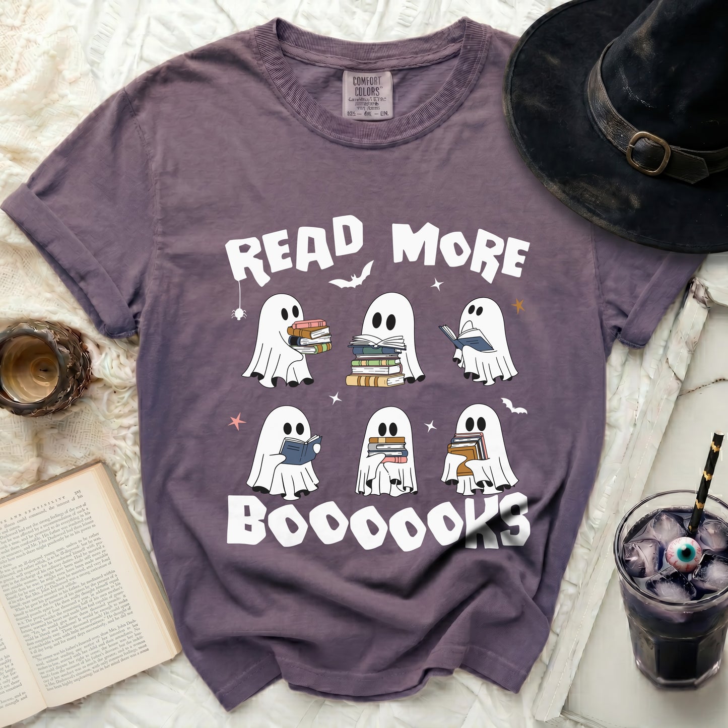 Purple t-shirt with ghosts reading books and "Read More Boooooks" text.