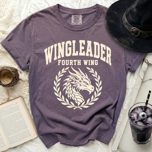 Purple t-shirt with white "WINGLEADER FOURTH WING" text and dragon design.