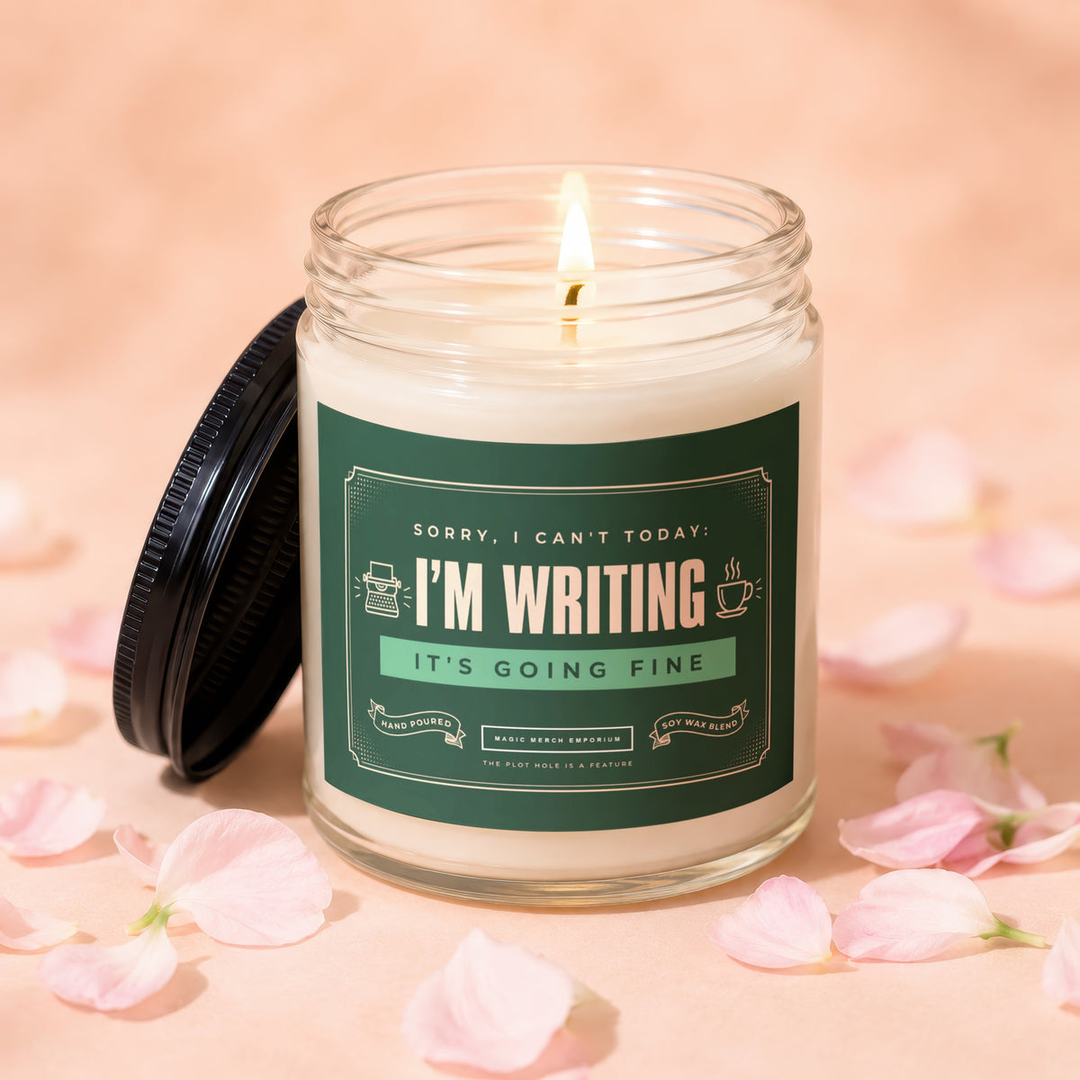 Candle with "I'm Writing, It's Going Fine" text, surrounded by pink petals.
