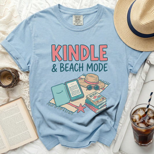 Light blue t-shirt with "KINDLE & BEACH MODE" graphic.