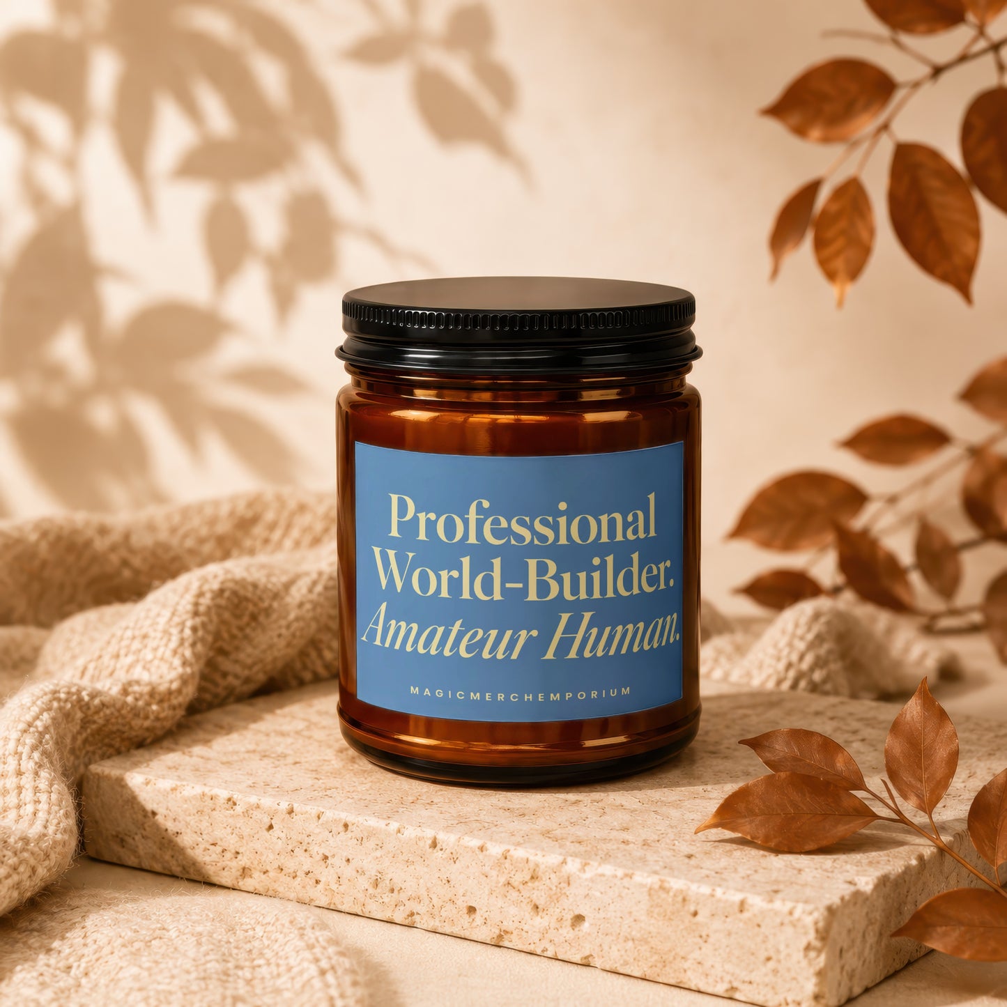 Amber jar candle with blue label reading "Professional World-Builder. Amateur Human. MAGICMERCH"}, {MAGICMERCHUM}