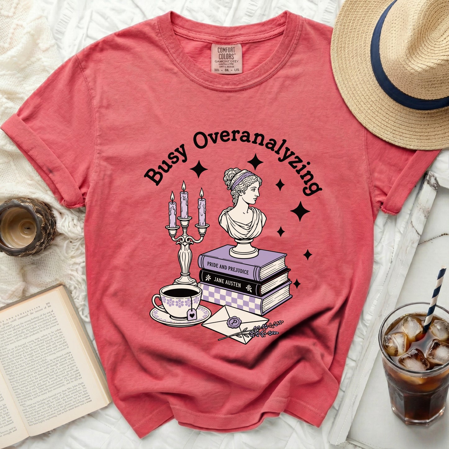 Coral t-shirt with "Busy Overanalyzing" text, bust, books, and tea.