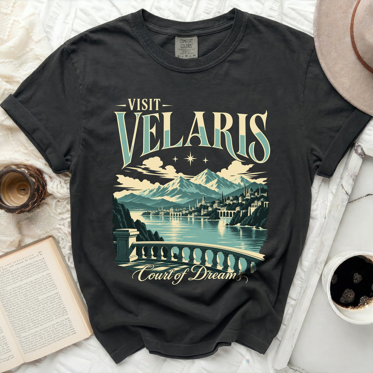 Dark t-shirt with "Visit Velaris Court of Dreams" text and landscape illustration.