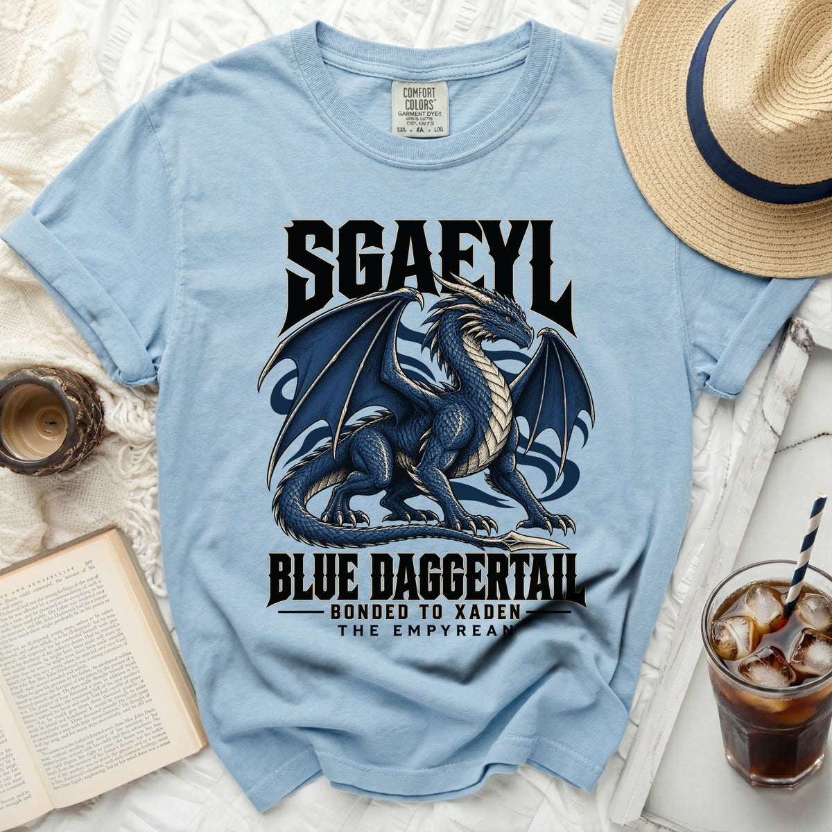 Light blue t-shirt with a blue dragon graphic and text "SGAEYL BLUE DAGGERTAIL".