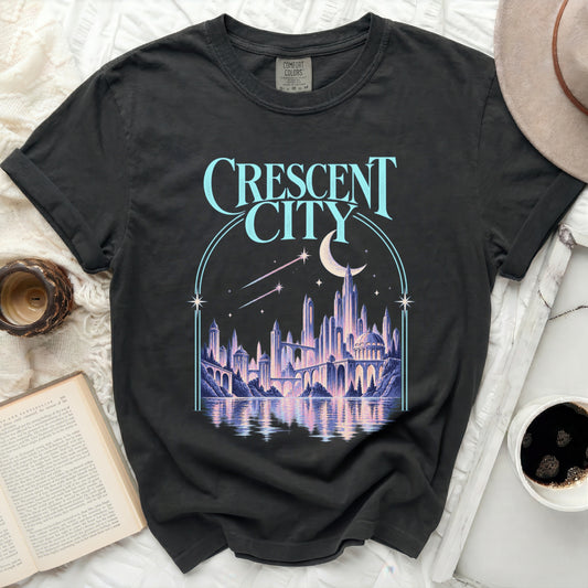 Dark t-shirt with "Crescent City" text and fantasy cityscape graphic.
