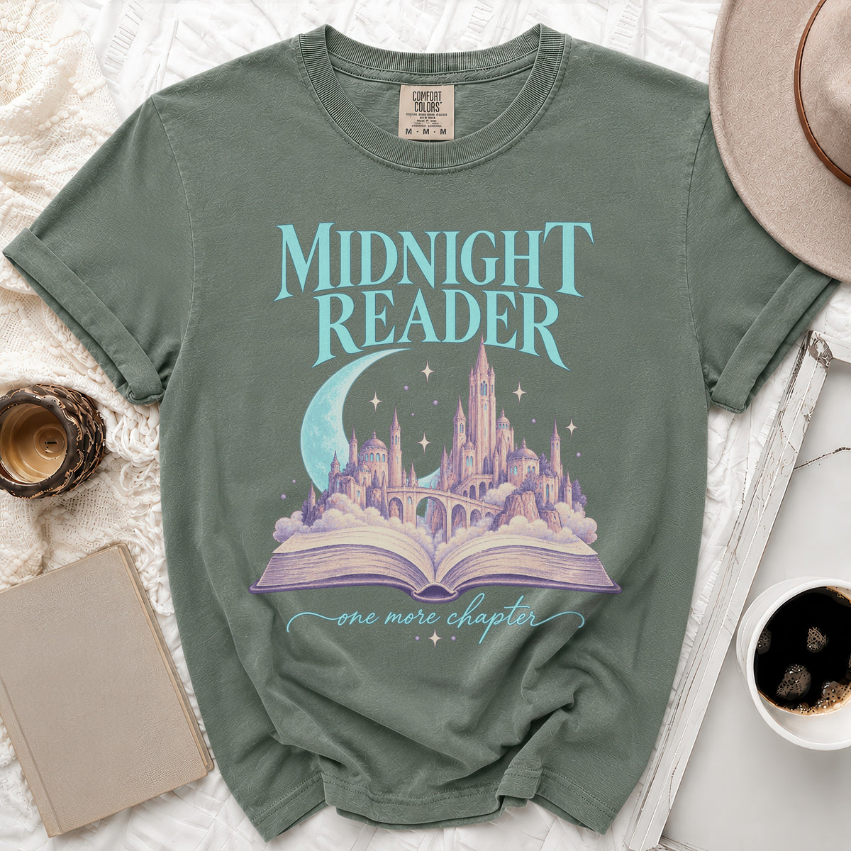 Green t-shirt with "Midnight Reader" text and a castle emerging from an open book.