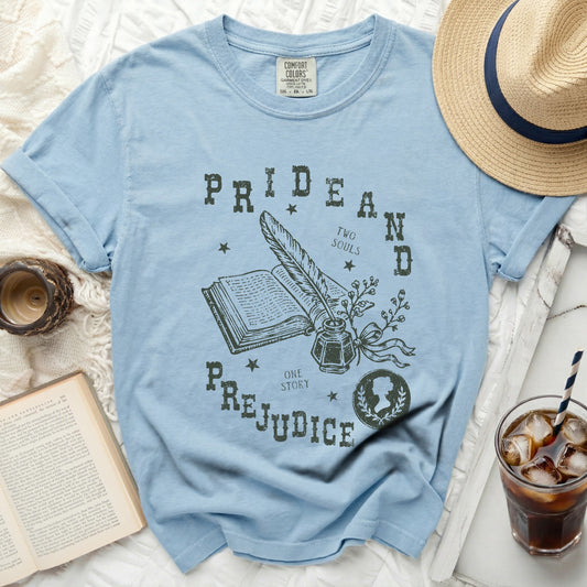 Light blue t-shirt with "Pride and Prejudice" graphic, feather, inkwell, and book.