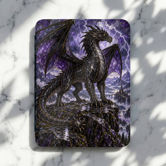 Black dragon with purple wings perched on cliff overlooking castle and waterfalls.