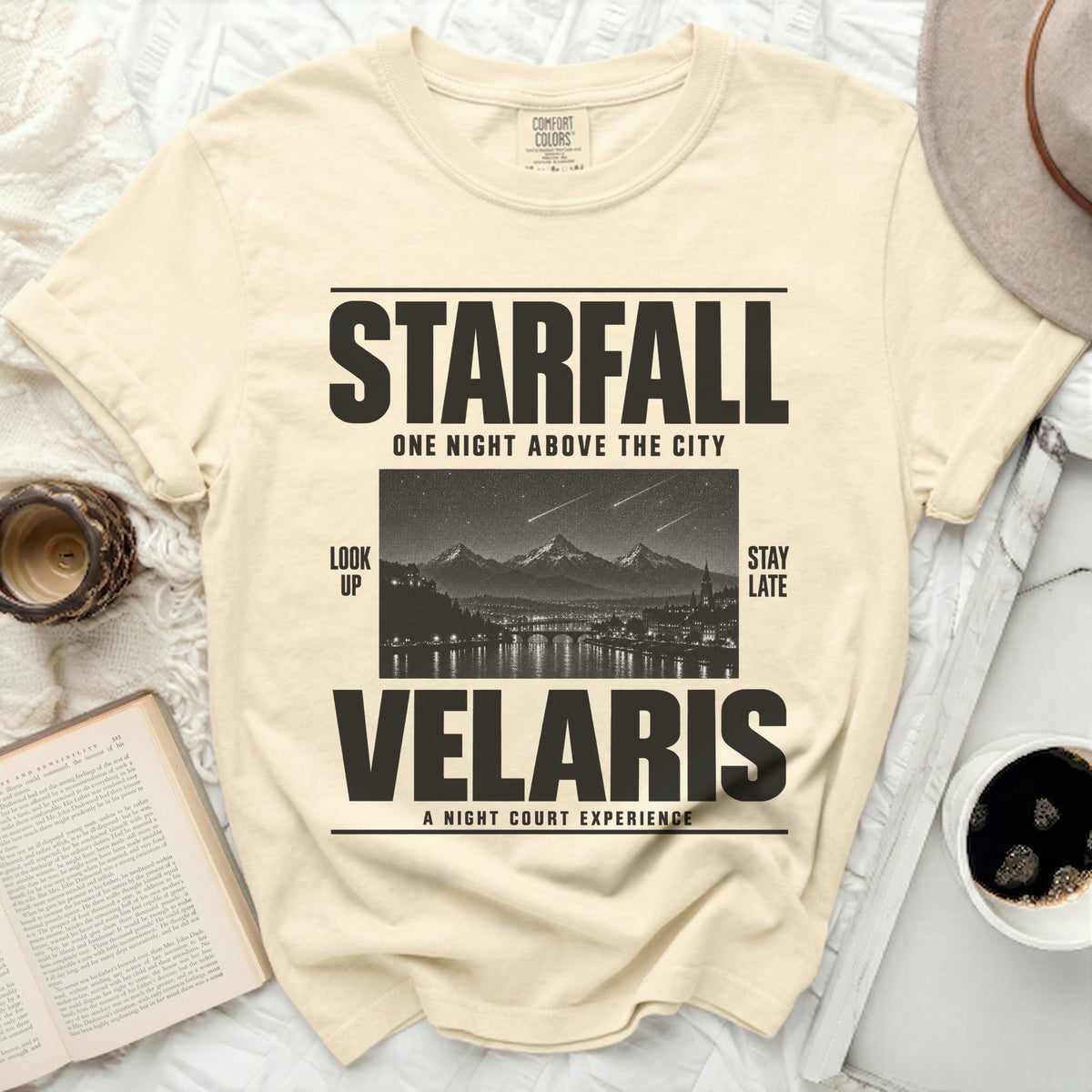 Cream t-shirt with "STARFALL VELARIS" text and a night city scene.