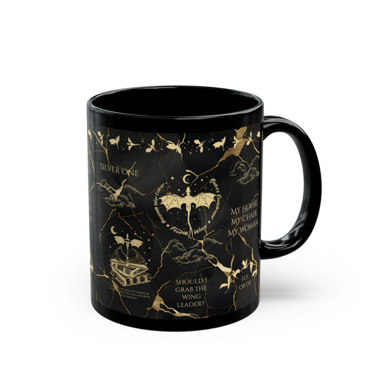 a black coffee mug with gold designs on it