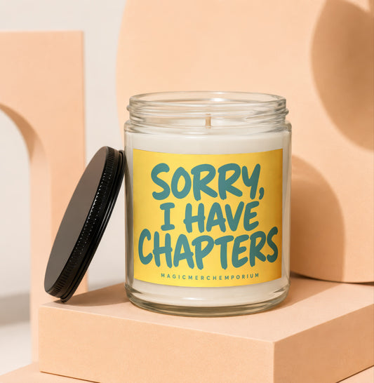 Glass candle with yellow label reading "SORRY, I HAVE CHAPTERS"