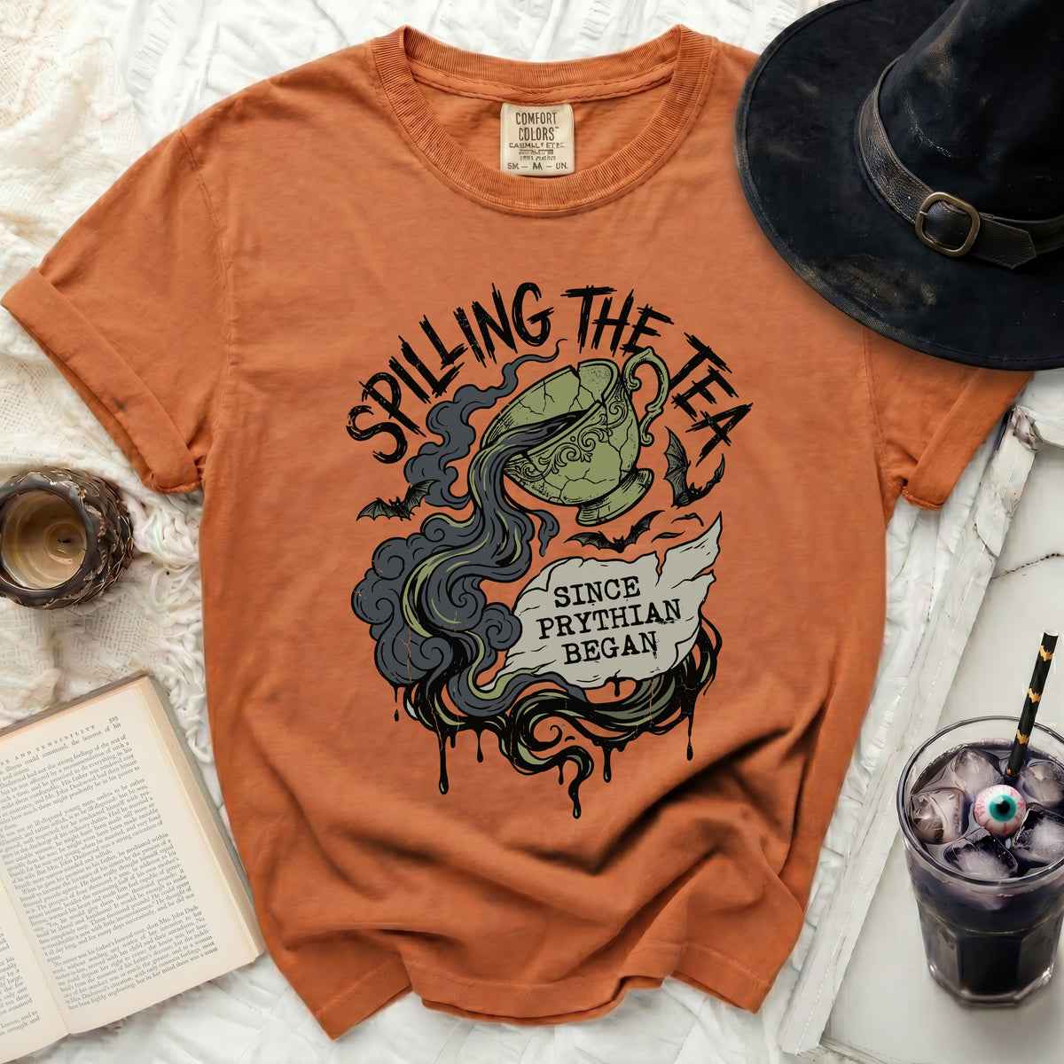 Orange t-shirt with "Spilling the Tea" and "Since Phyrian Began" graphic.
