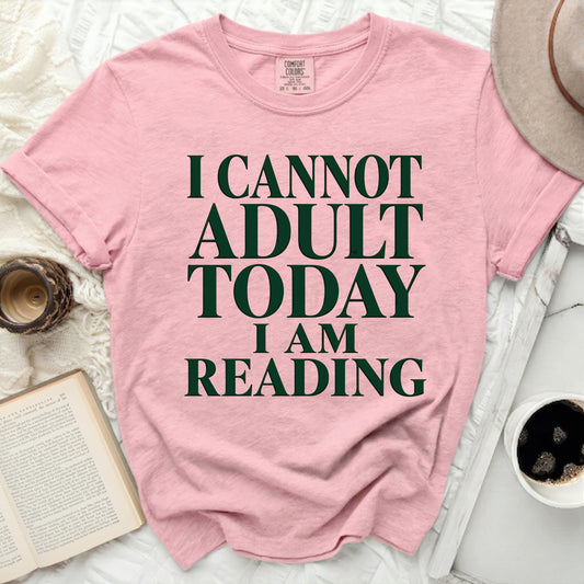 Pink t-shirt with "I CANNOT ADULT TODAY I AM READING" text.