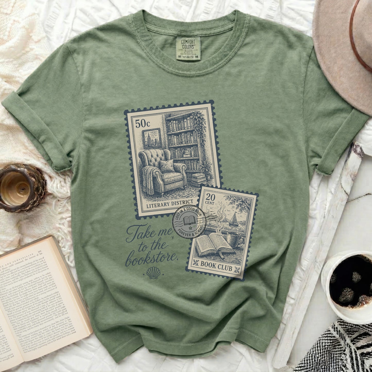 Green t-shirt with "Take me to the bookstore" and stamp graphics.