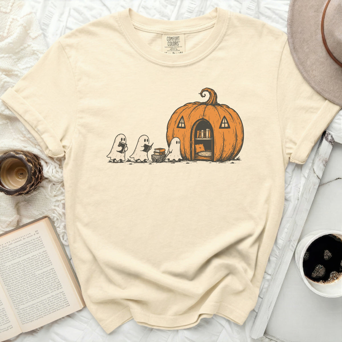 Ghosts carrying books approach a pumpkin house with an open door.