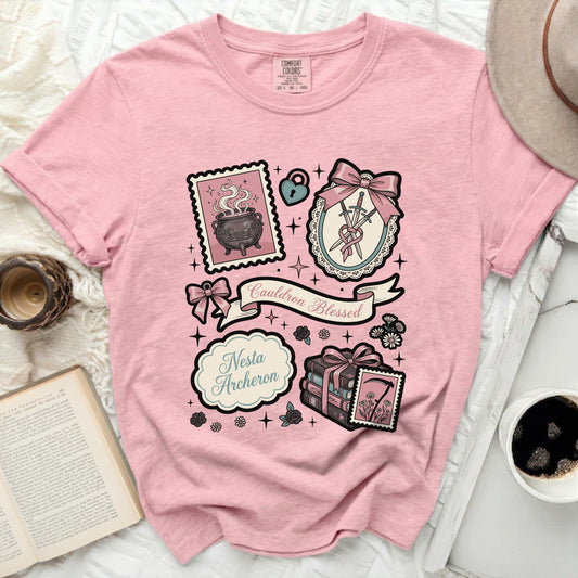 Pink t-shirt with "Cauldron Blessed" and "Nesta Archeron" graphic.