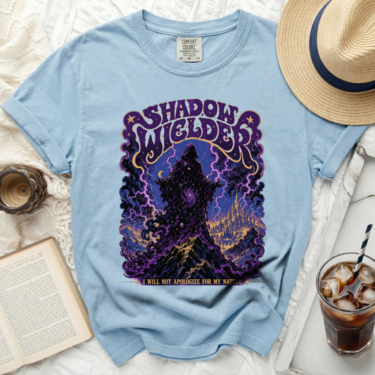 Light blue t-shirt with "Shadow Welder" graphic and quote.