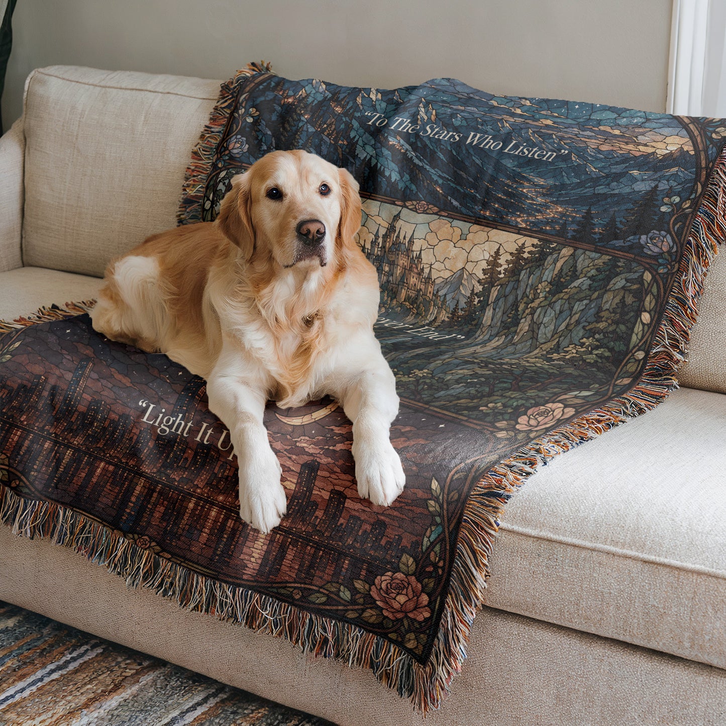 A golden retriever dog is lying on a couch, resting its head on a decorative blanket with a landscape design.