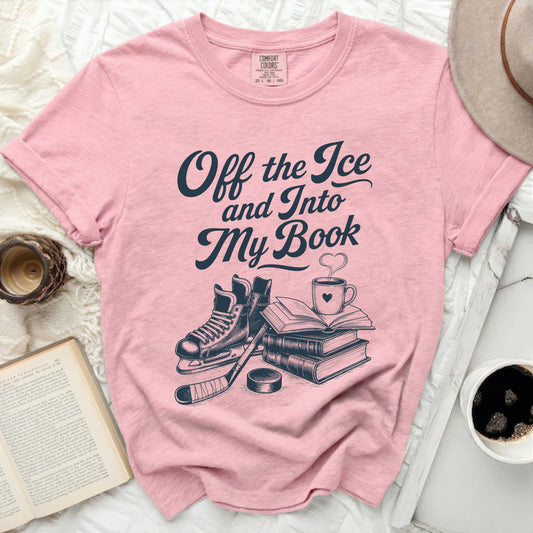Pink t-shirt with "Off the Ice and Into My Book" text, hockey skates, and books.