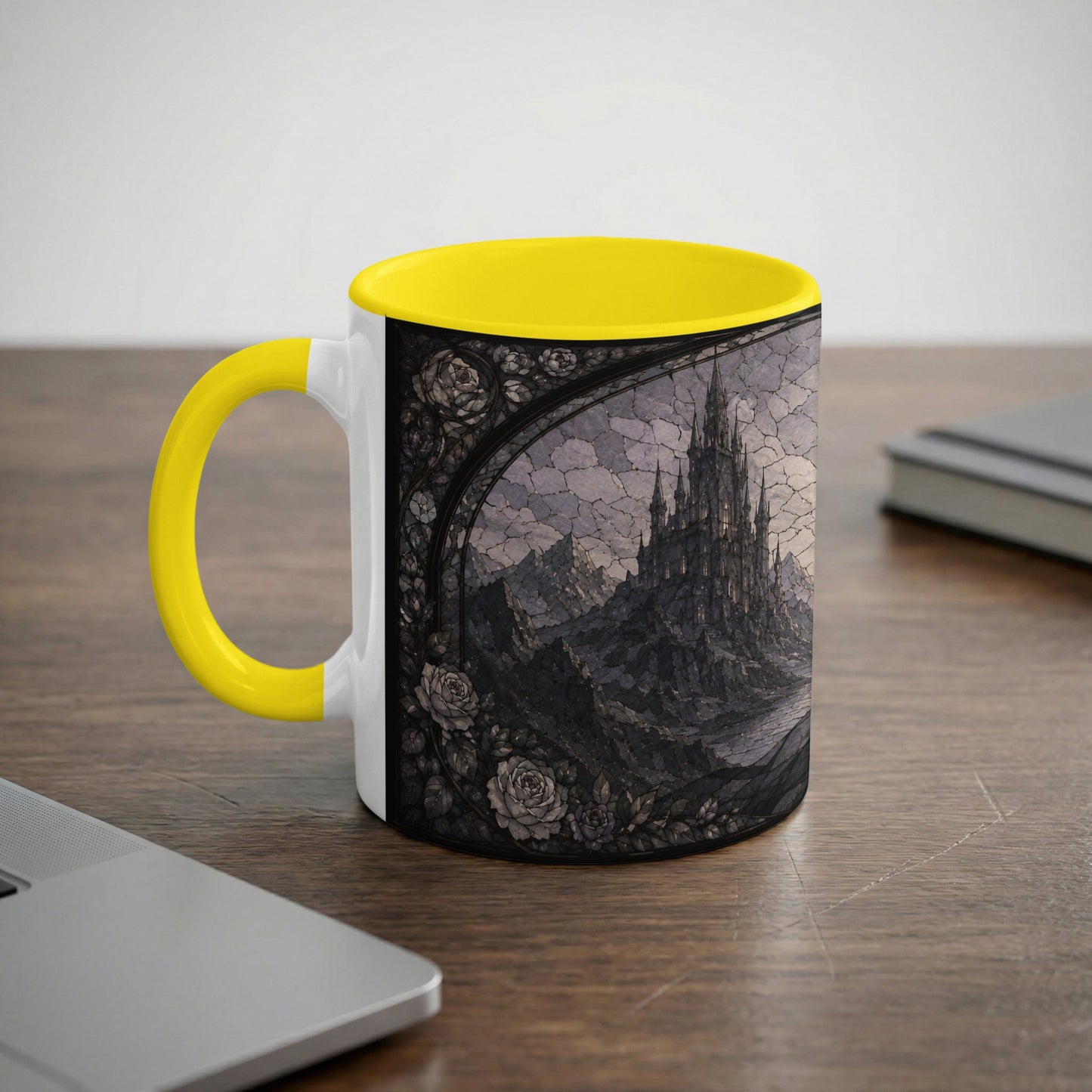 White mug with yellow handle featuring a dark, gothic castle and roses design.