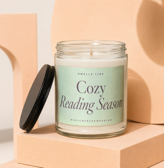 Candle titled "Cozy Reading Season" by MagicMerchEmporium with lid off.