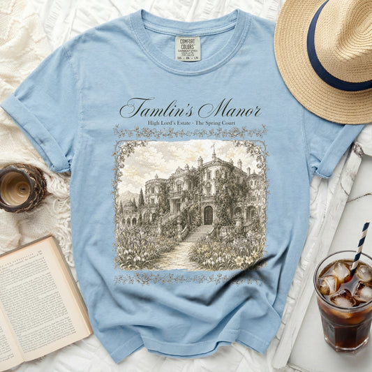 Blue t-shirt with "Tamlin's Manor" and manor illustration.