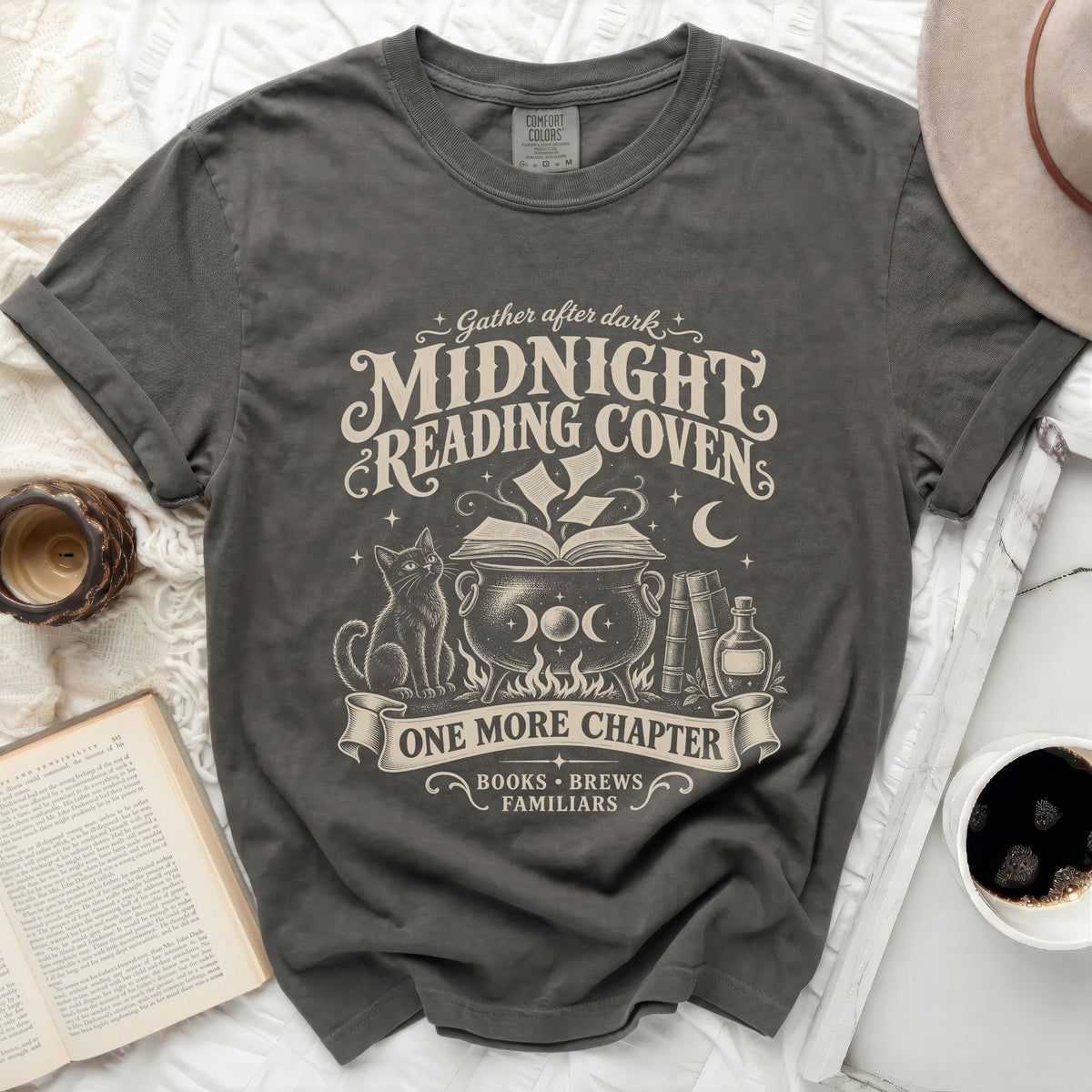 Dark grey t-shirt with "Midnight Reading Coven" graphic featuring a cat, cauldron, and books.