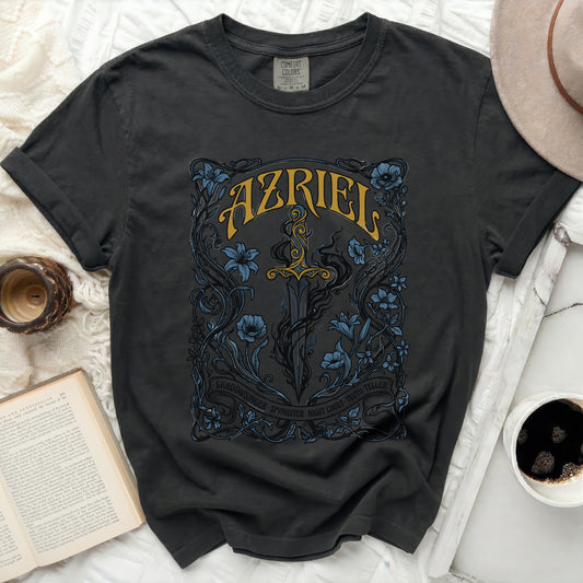 Dark t-shirt with ornate sword and floral design, reads AZRIEL SHADOWSINGER.