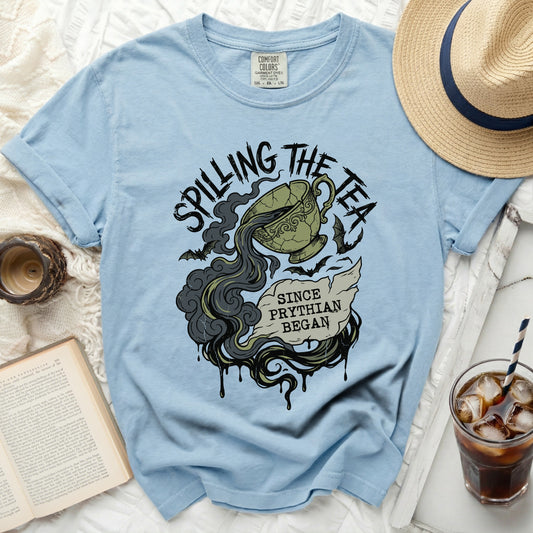 Light blue t-shirt with "Spilling the Tea Since Pythian Began" graphic.
