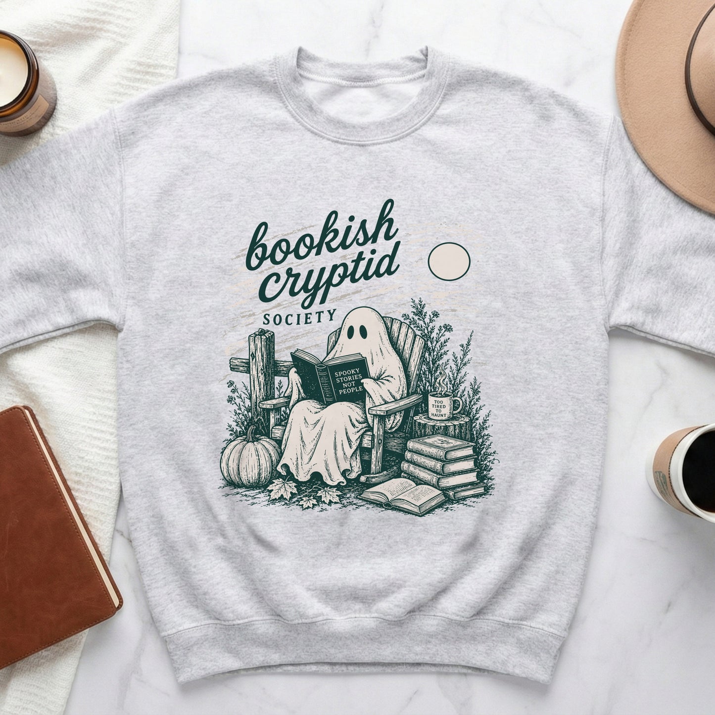 Grey sweatshirt with "bookish cryptid SOCIETY" and a ghost reading.