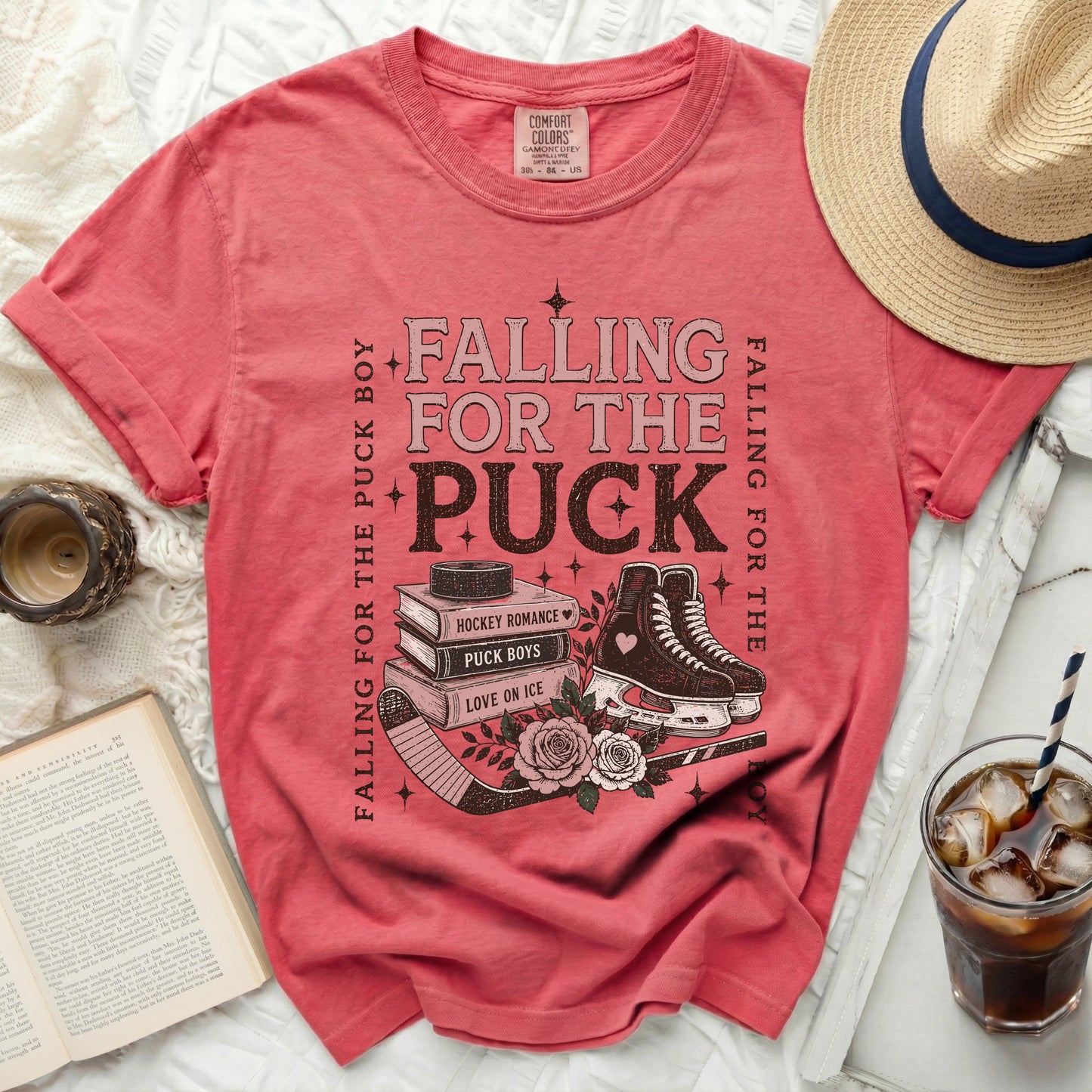 Pink t-shirt with "Falling for the Puck Boy" text and hockey skates.