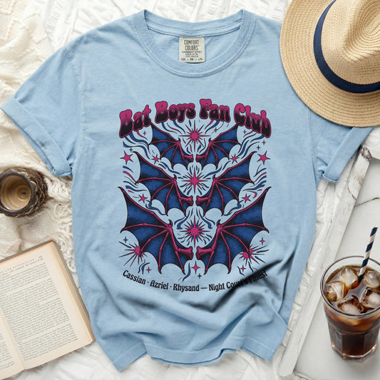 Light blue t-shirt with "Bat Boys Fan Club" and bat wings graphic.