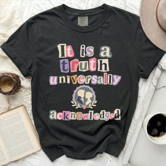 Dark grey Comfort Colors t-shirt, "It is a truth universally acknowledged" text, cameo couple graphic.