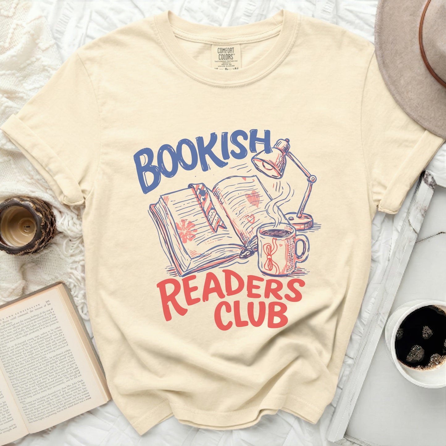 Bookish Readers Club graphic on cream t-shirt with book and lamp.