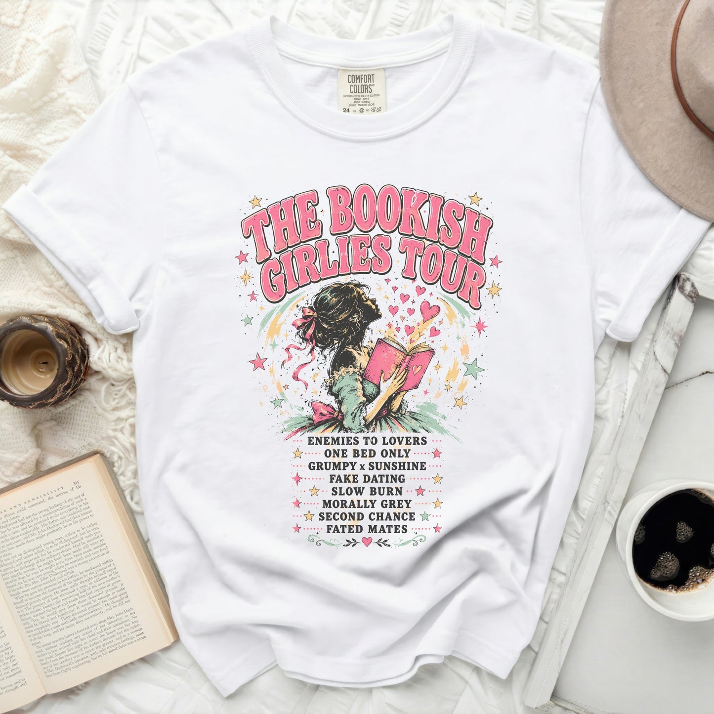 White t-shirt with "The Bookish Girlies Tour" text and book-themed romantic tropes.