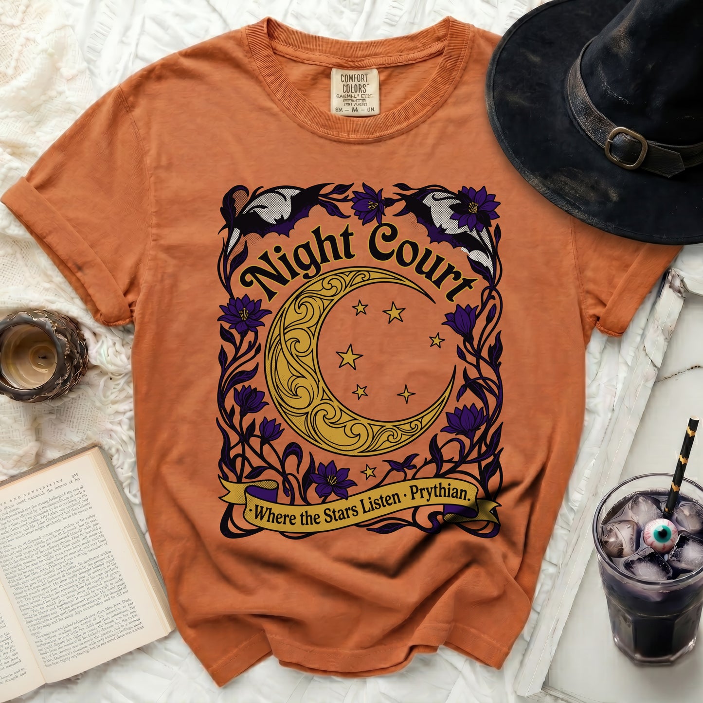 Orange t-shirt with "Night Court" and crescent moon graphic.
