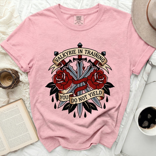 Pink t-shirt with "Valkyrie in Training. You Do Not Yield" tattoo-style design.