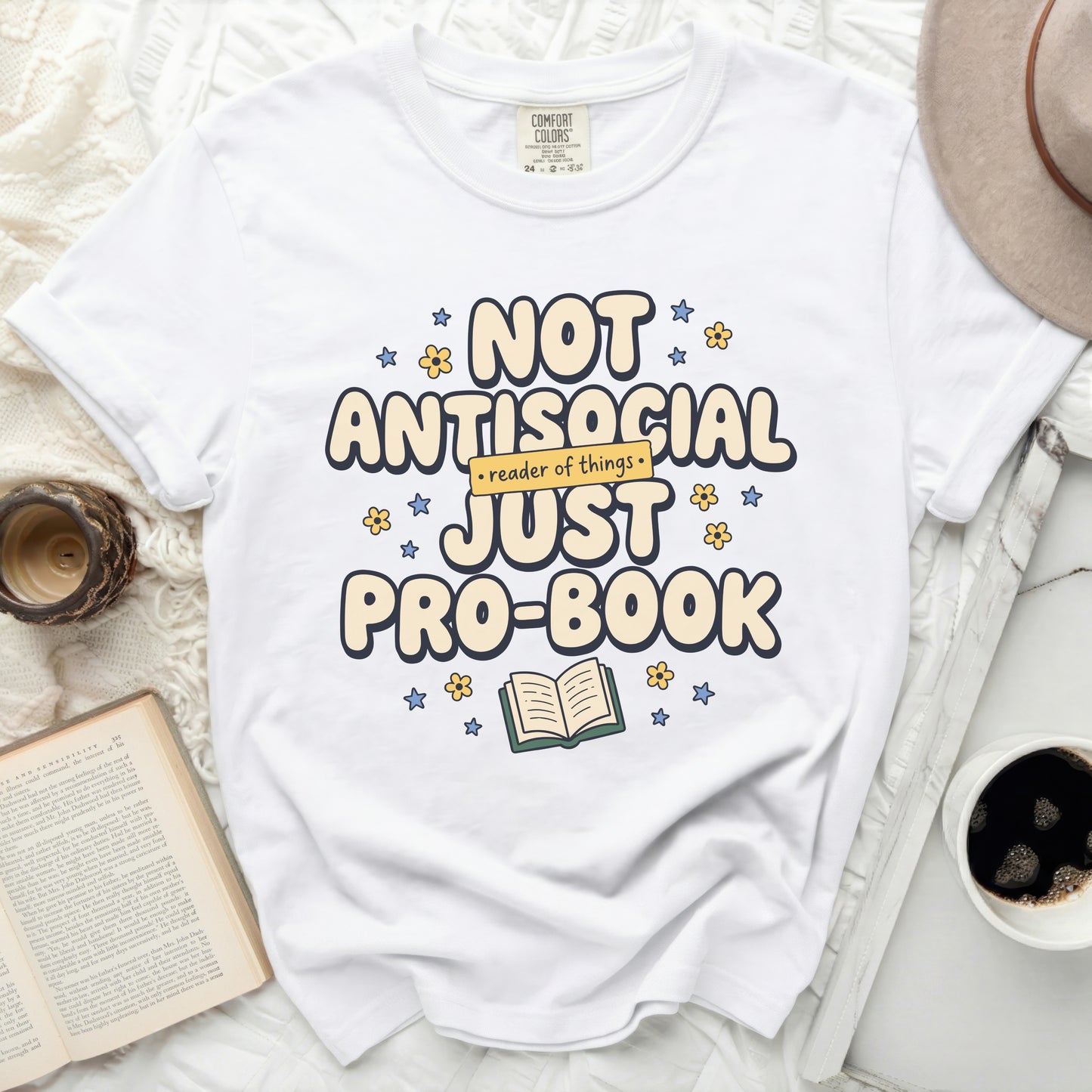 White t-shirt with "Not antisocial, just pro-book" text and graphic.