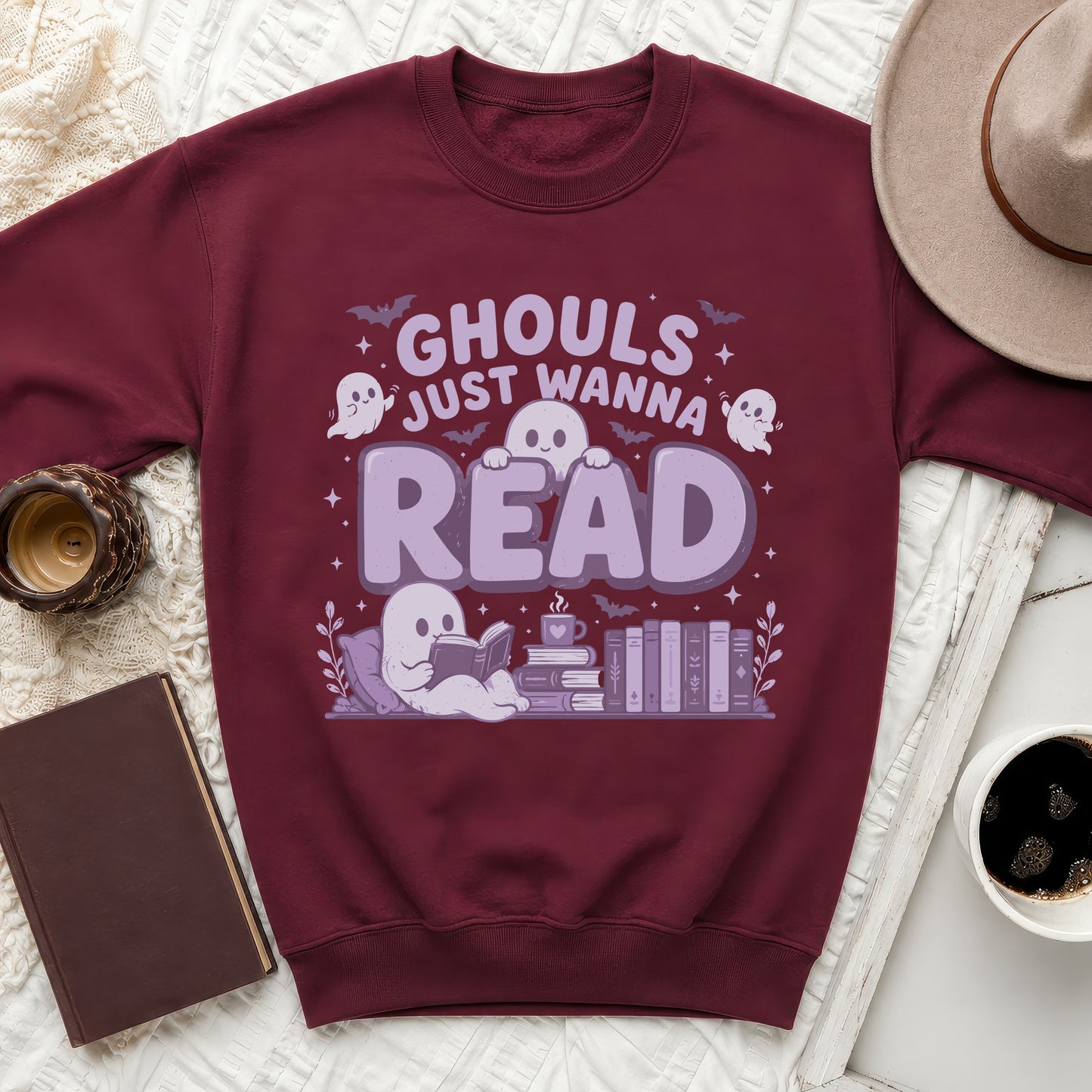 Maroon sweatshirt with "Ghouls Just Wanna Read" text and ghost illustrations.