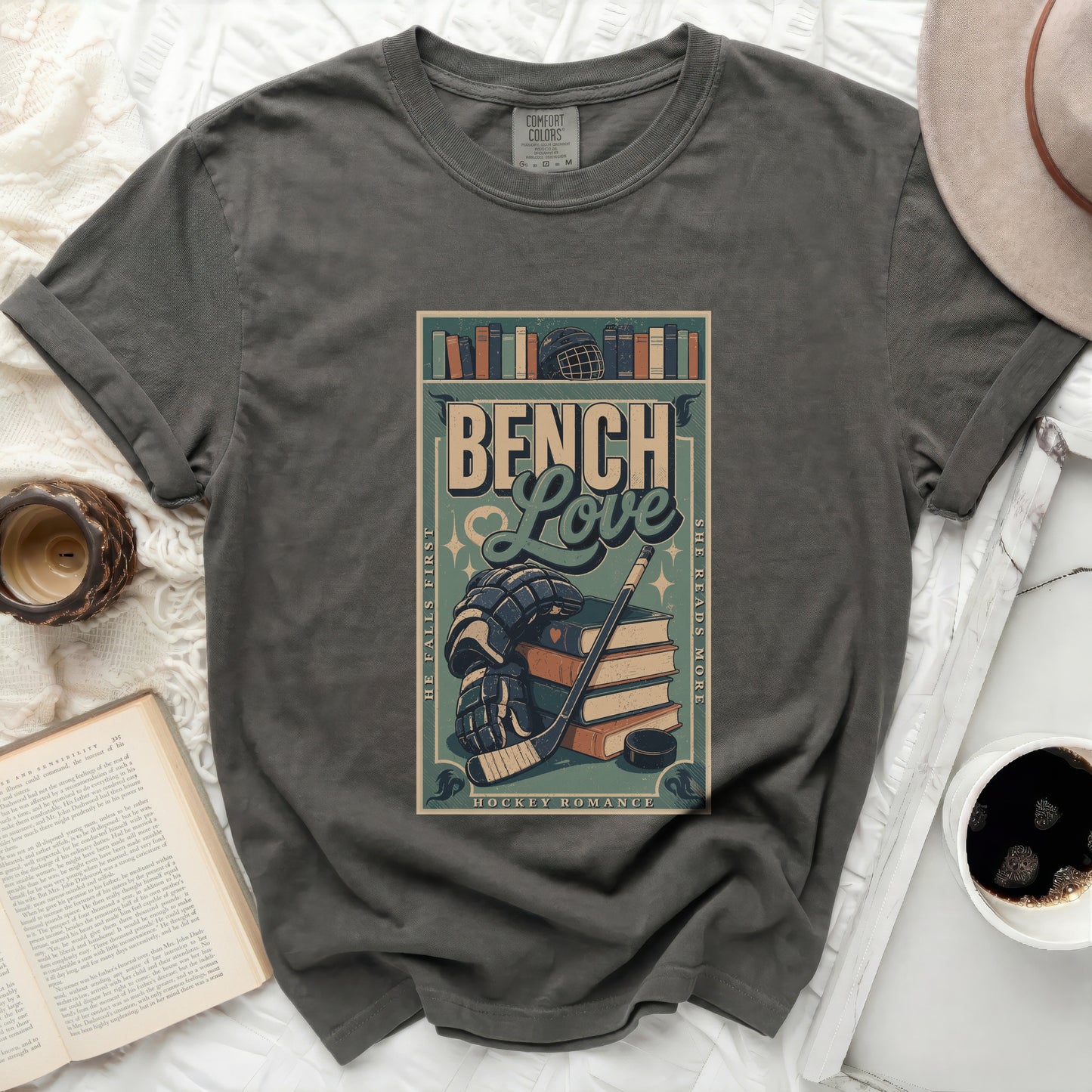 Dark t-shirt with "Bench Love Hockey Romance" text and hockey gear.