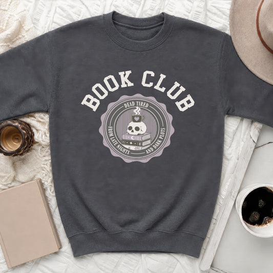 Crewneck sweatshirt with "Book Club" and skull, coffee, and book graphic.