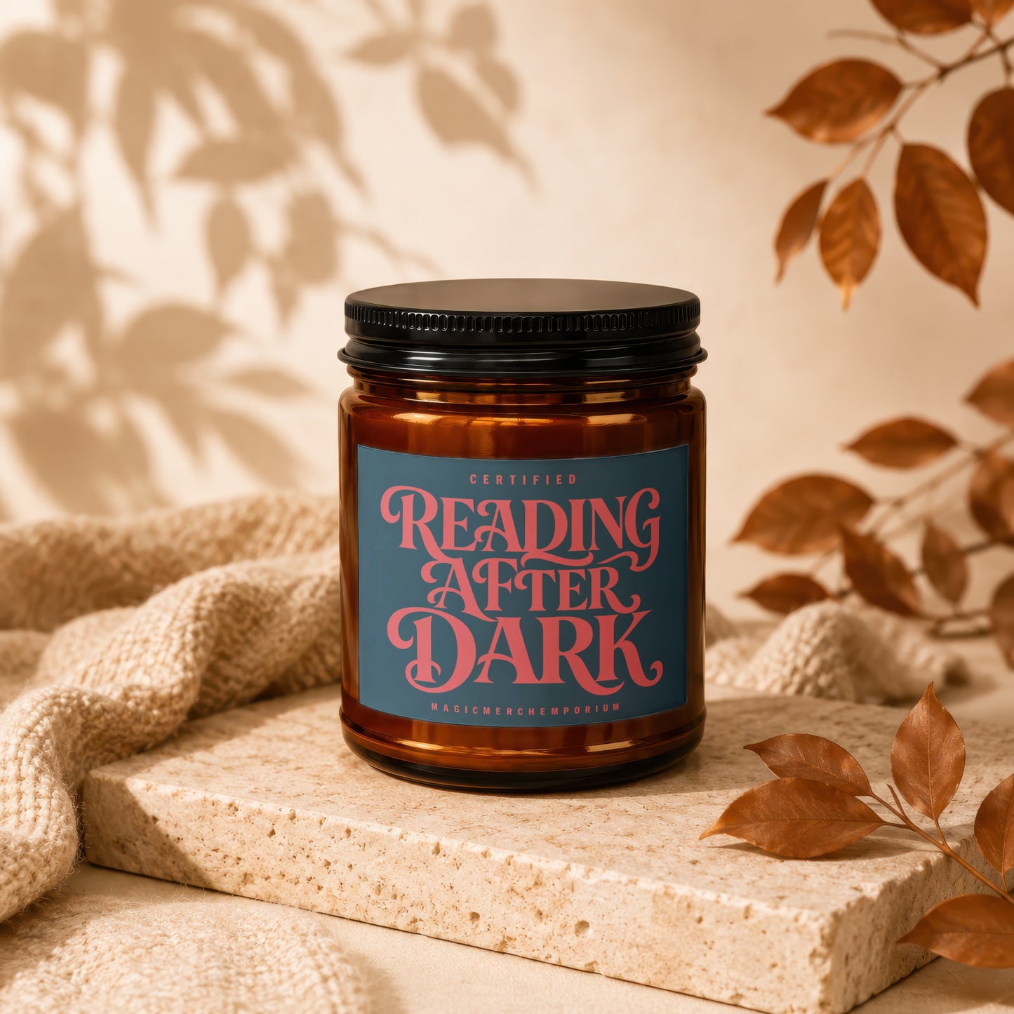 Amber candle labeled "Reading After Dark" by MagicMerchEmporium.