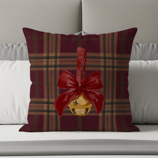 Festive Plaid Pillow with Bell and Red Bow Design