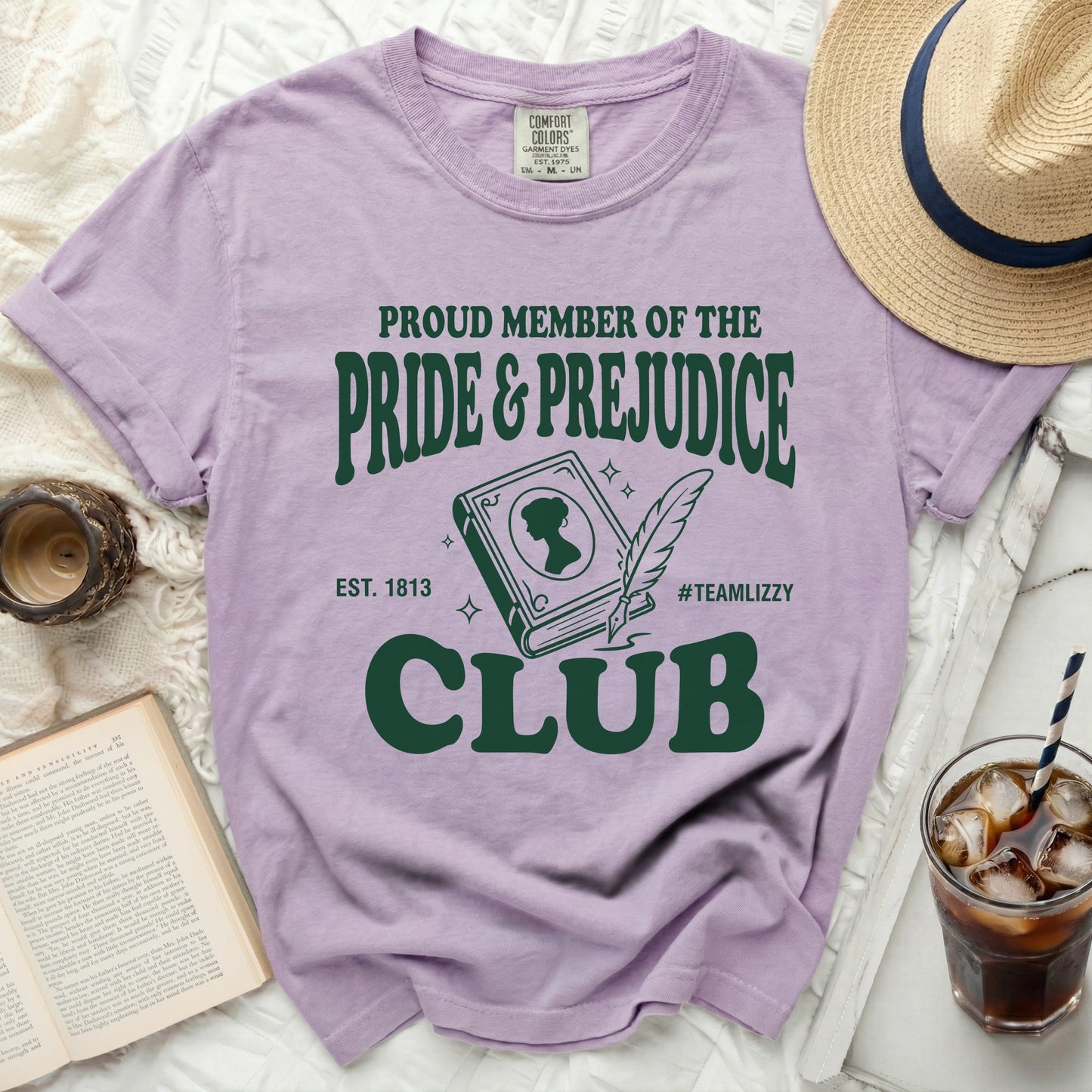 Proud member of the Pride and Prejudice Club t-shirt with a book graphic.