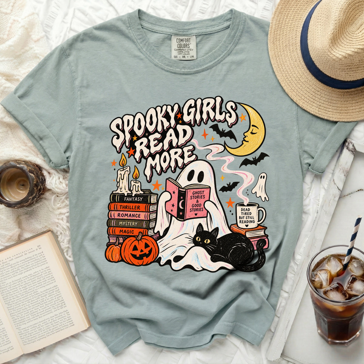 Graphic t-shirt with "Spooky Girls Read More" text and Halloween-themed illustrations.