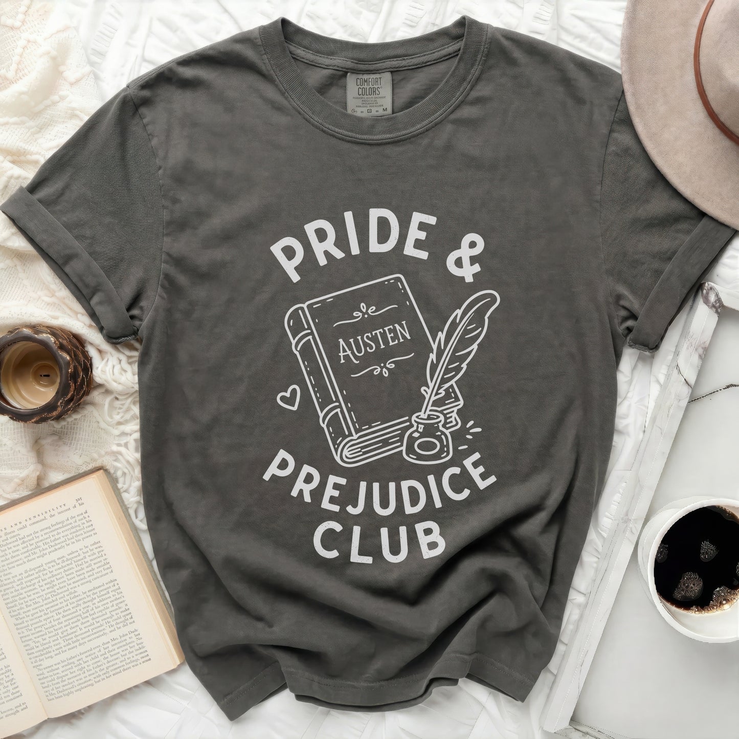 "Pride & Prejudice Club" t-shirt with Austen book and quill graphic.